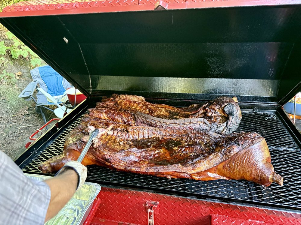 A whole hog roasting in the Pig & Pint cooker
